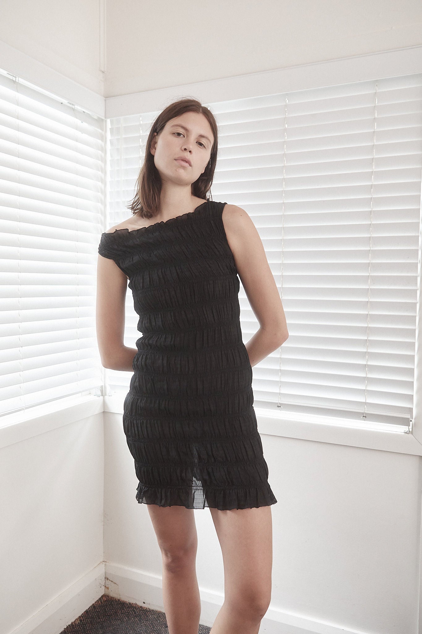 CORE Gathered Mini Dress | Black $339